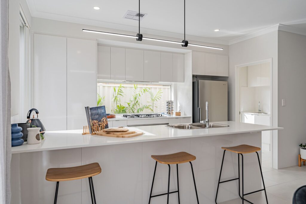 clean white kitchen with natural light shining